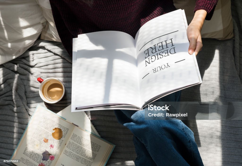 Aerial view of woman reading a book Magazine - Publication Stock Photo