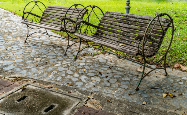 istock Wood bench on concrete floor 875078722