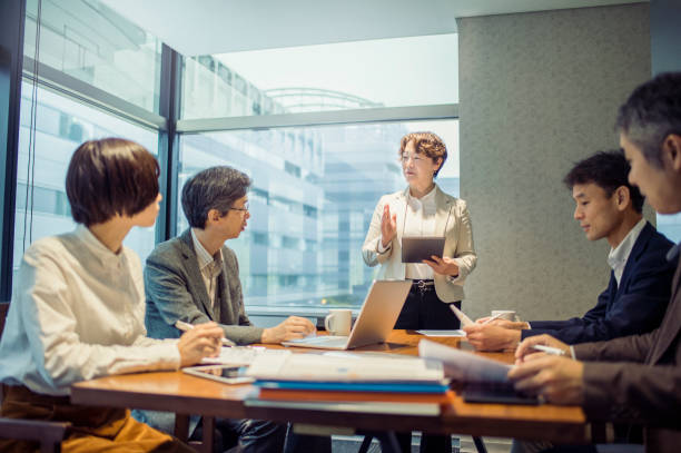 istock Business team having a meeting in conference room 875084268