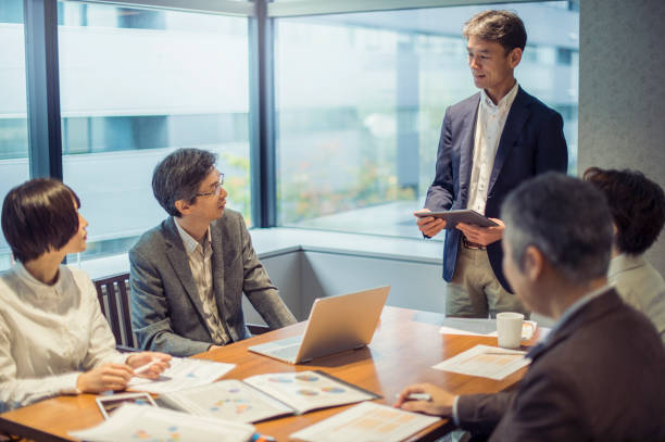 istock Business team having a meeting in conference room 875084286