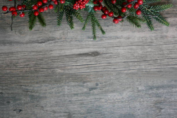 istock Christmas Pine Branches and Berries Over Wood Horizontal Background 875084772