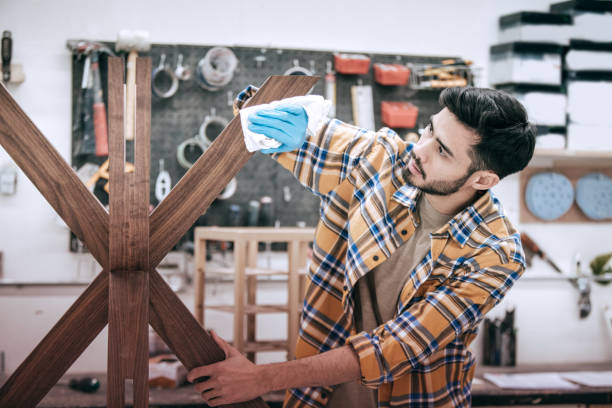 istock Polishing furniture at workshop 875097012