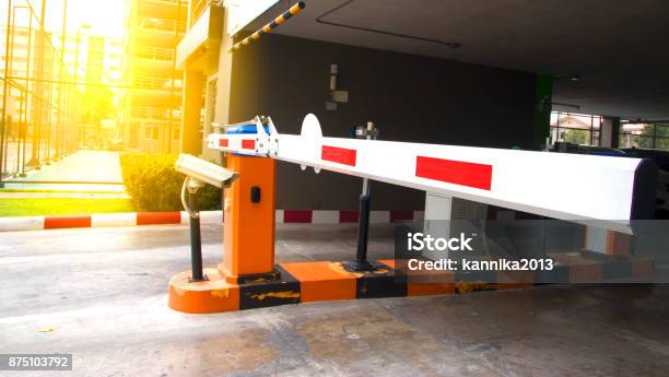 Security System For Building Access Barrier Gate Stop With Toll Booth Traffic Cones And Cctv Stock Photo - Download Image Now