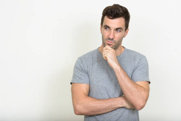 istock Handsome muscular man wearing gray shirt against white background 875107220