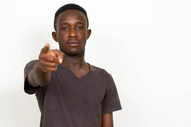 istock Young African man wearing brown shirt against white background 875107650