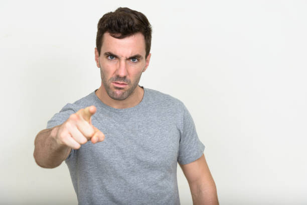 istock Handsome muscular man wearing gray shirt against white background 875107656