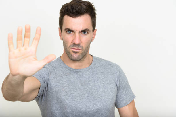 istock Handsome muscular man wearing gray shirt against white background 875107744