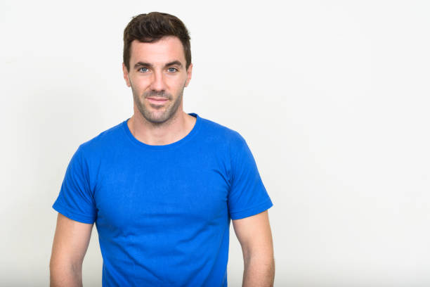istock Handsome man wearing blue shirt against white background 875107798