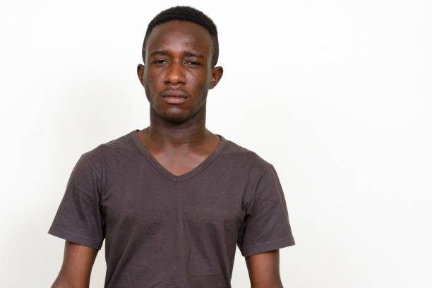 istock Young African man wearing brown shirt against white background 875110462