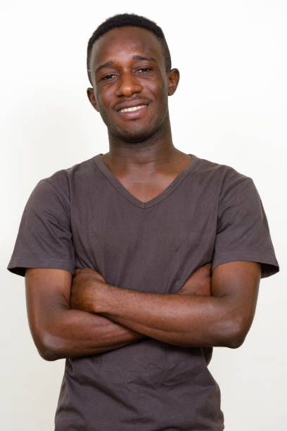 istock Young African man wearing brown shirt against white background 875110510