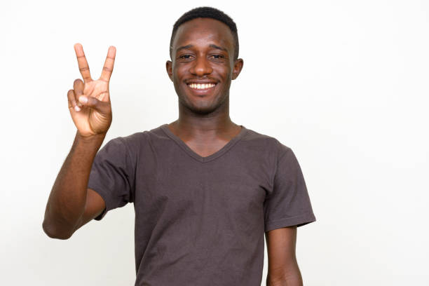 istock Young African man wearing brown shirt against white background 875112958