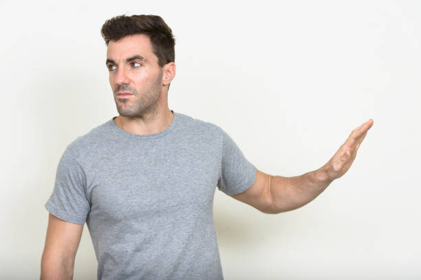 istock Handsome muscular man wearing gray shirt against white background 875113244