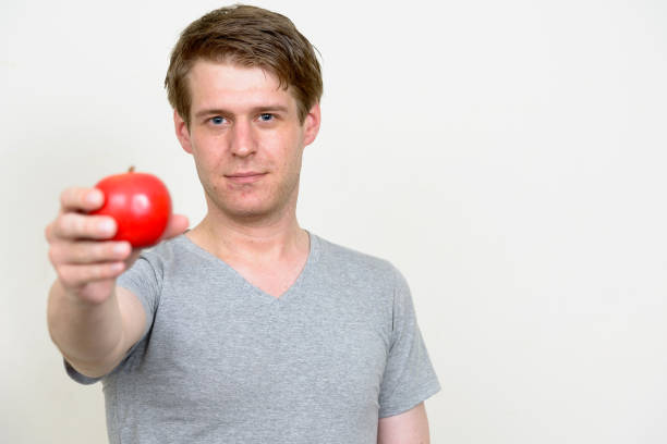 istock Young handsome man wearing gray shirt ready for gym against white background 875113246