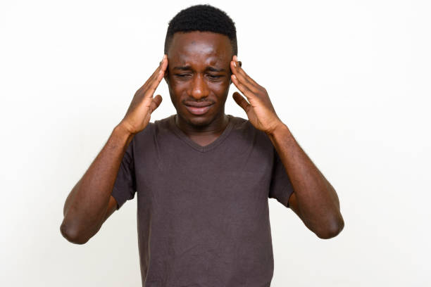 istock Young African man wearing brown shirt against white background 875113324