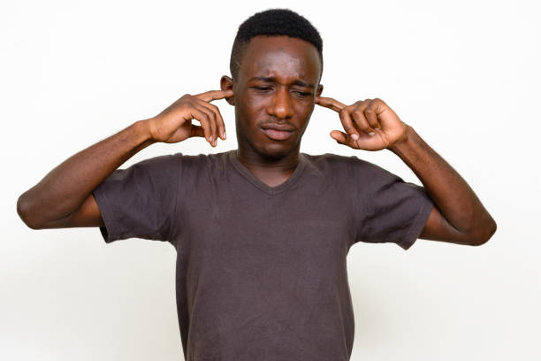 istock Young African man wearing brown shirt against white background 875113366