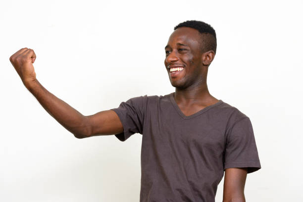 istock Young African man wearing brown shirt against white background 875113420