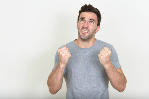 istock Handsome muscular man wearing gray shirt against white background 875113612