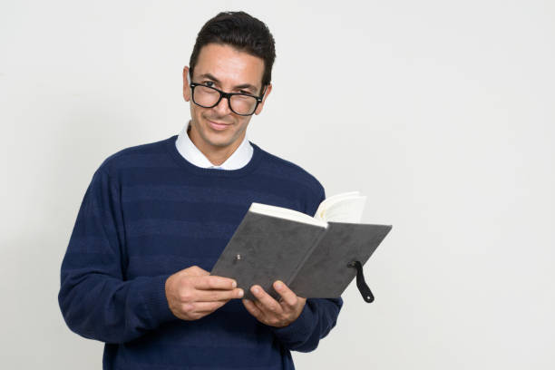 istock Mature handsome man wearing blue sweater against white background 875117500