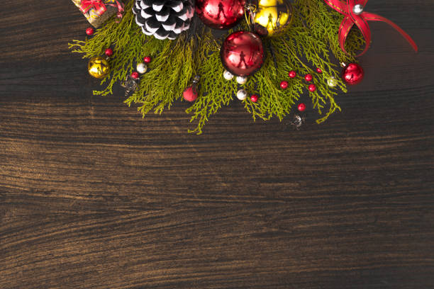 istock Top view on nice Christmas gift wrapped in white gift paper, Christmas tree decorations on dark wooden background. New Year holiday 875120142