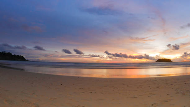 istock beautiful beach with twilight cloudy sky in the evening. 875120892
