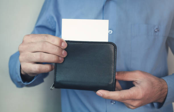 istock Businessman holding wallet with business card. 875123896