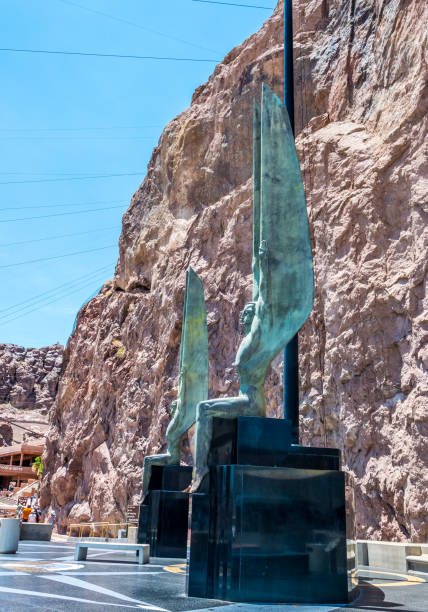 Monument of fame on Hoover Dam. Nevada Tourist Attractions Boulder City, Nevada, USA - June 19, 2017: Monument in honor of workers and builders of the Hoover Dam in Nevada and Arizona. US Tourist Attraction - The Hoover Dam Hydropower Station on the Colorado River hoover dam statues stock pictures, royalty-free photos & images