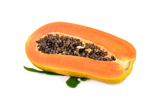istock half cut ripe papaya with seed and leaf on white background 875124844