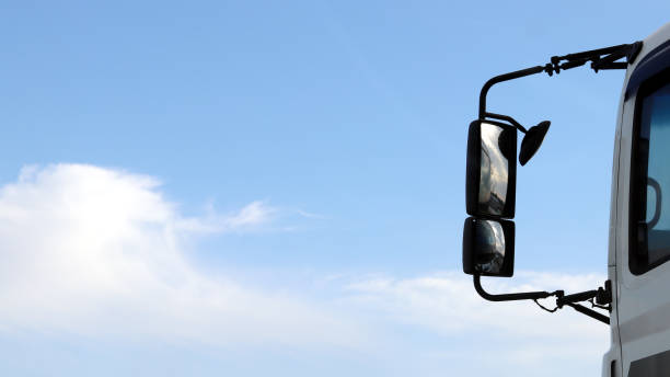 rear view mirror of a running truck stock photo