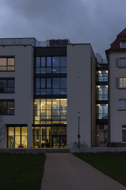 istock office buildings with sunset autumn colored sky and clouds 875127420