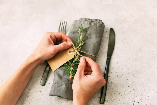 istock Woman hands decorated napkin for Christmas place table setting. Diy concept 875138290