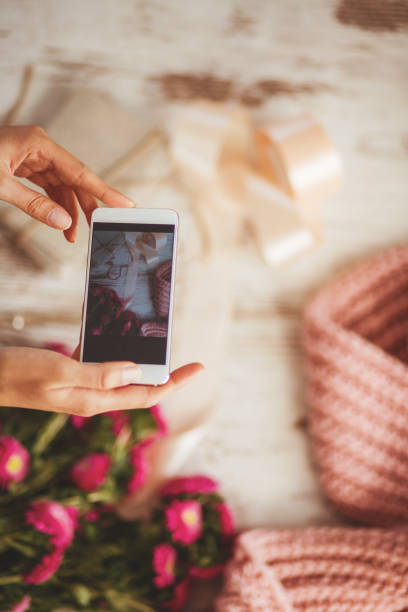 istock Woman is photographing her creative work 875140746