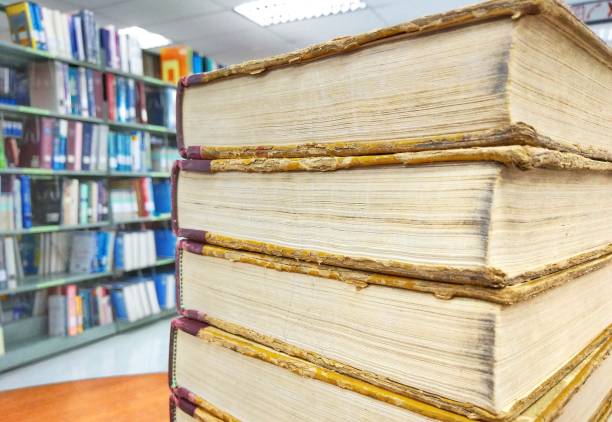 istock Old books on old wooden table 875157322