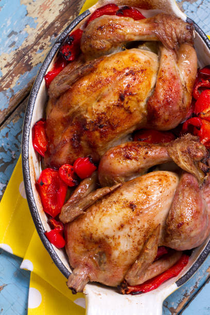istock Whole baked chicks with lemon, paprika and cayenne pepper 875162308