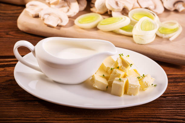 istock Ingredients for the mushroom dishes: cream, butter, leeks, champignons 875162428