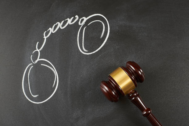 istock Judge gavel on blackboard background with painted handcuffs. 875165086
