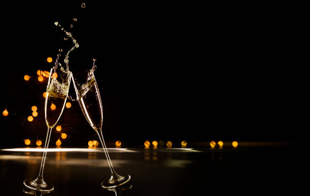 Champagne Glasses Infront Of Defocused Lights