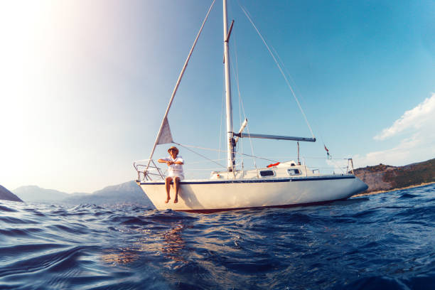 istock Woman enjoying her vacation on sailboat 875168930