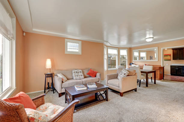 istock Cozy living and dining room interior with peach walls 875169500
