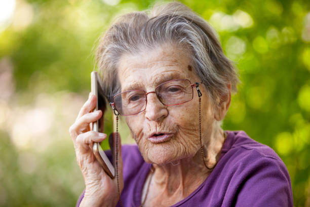 istock Senior Woman Using Mobile Phone Portrait 875172258