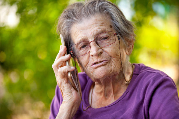 istock Senior Woman Using Mobile Phone Portrait 875172276