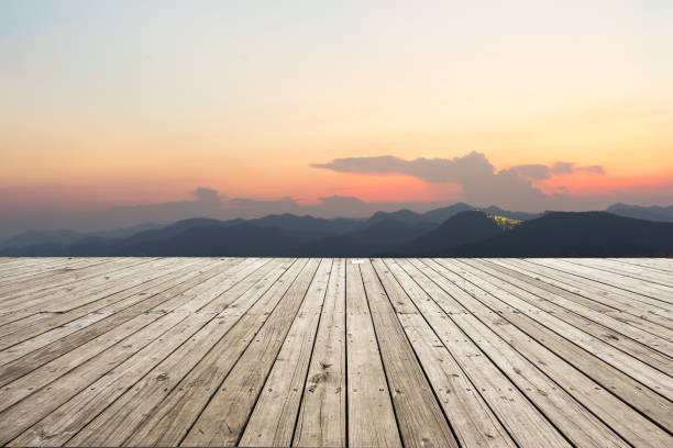 istock empty wooden floor with green mountains at twilight 875172652