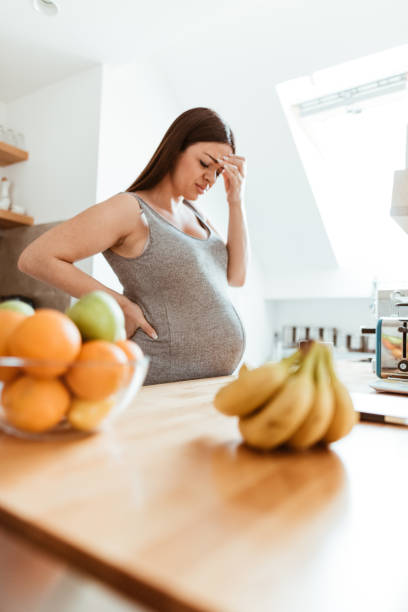 istock pregnant woman feeling bad at home 875179022
