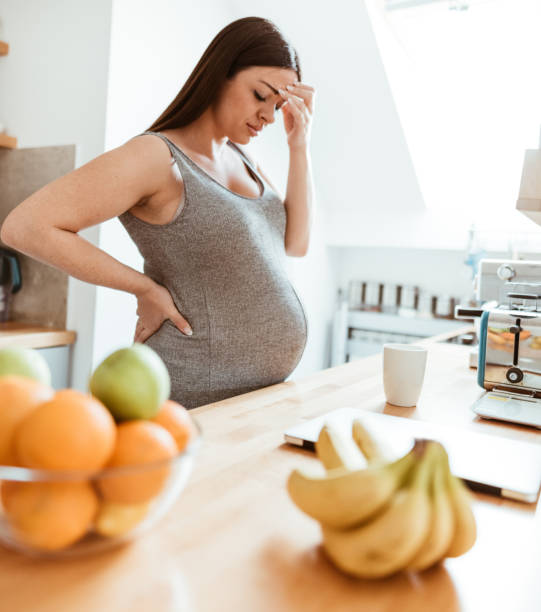 istock pregnant woman feeling bad at home 875179238