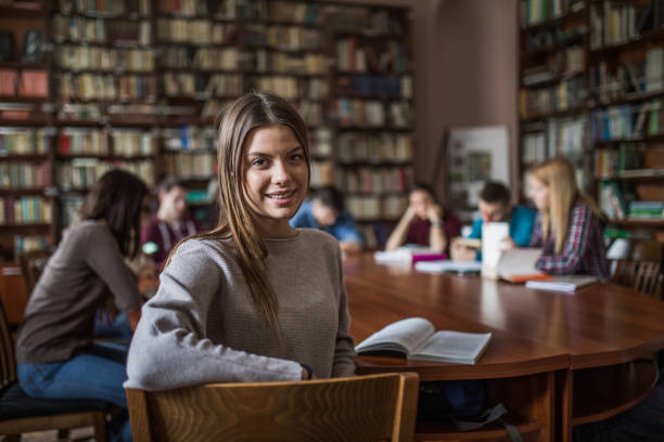istock Happy high school student in the library. 875179246