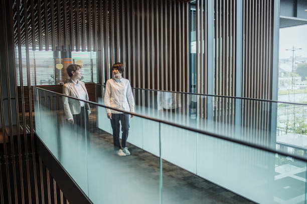 istock Women walking in the office with colleagues 875179878