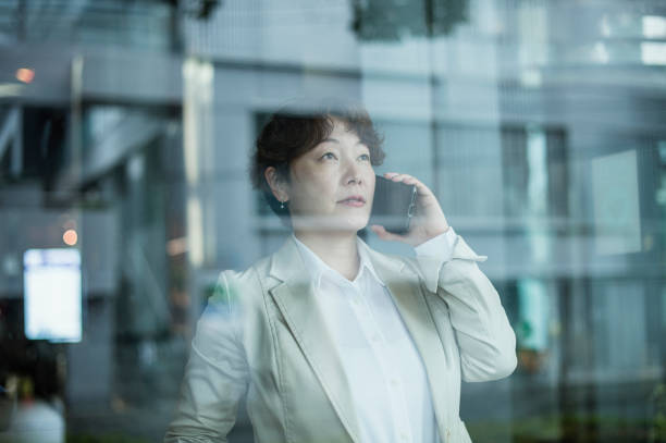 istock Women talking with smartphone 875179910