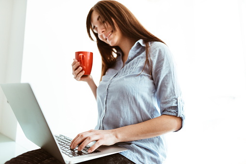 woman drinking a coffee at home