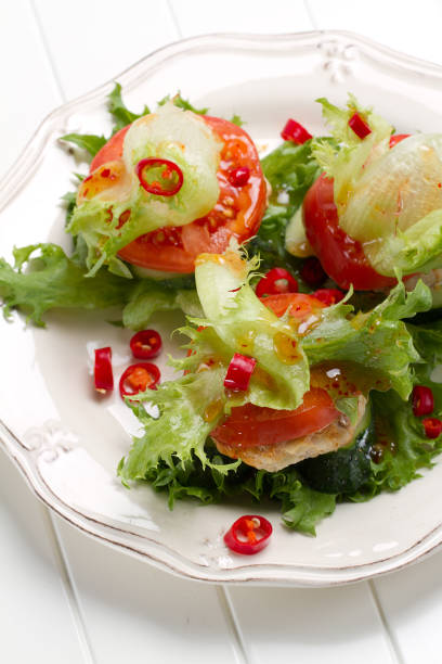 istock Low-calorie turkey and onion burger with lettuce, tomatoes and cucumbers 875180250