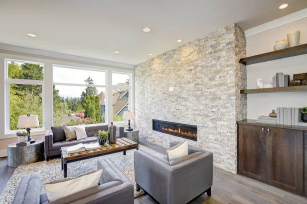 istock Modern great room with a floor to ceiling stone fireplace 875182458