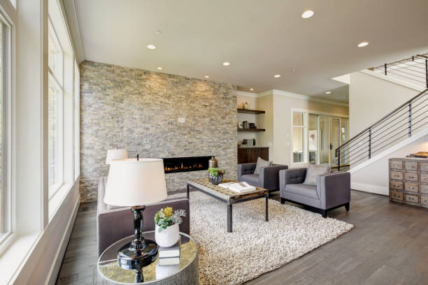istock Modern great room with a floor to ceiling stone fireplace 875182786